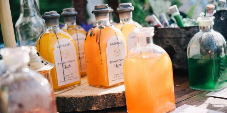 Gold potion bottles on a wooden slab.